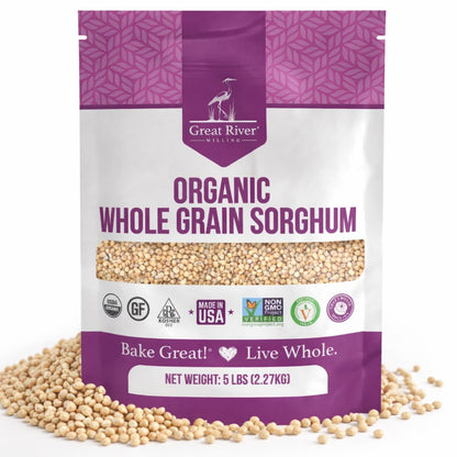 A purple and white bag of Organic Whole Grain Sorghum, 5 lbs. The packaging features multiple certifications and displays grains scattered around the bag—an excellent option for anyone seeking to purchase organic sorghum in bulk for wholesome cooking and baking.