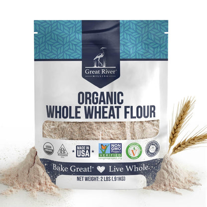 Organic Whole Wheat Flour bag by Great River Milling with wheat stalks and scattered flour