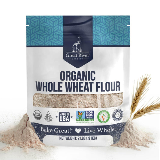Organic Whole Wheat Flour bag by Great River Milling with wheat stalks and scattered flour