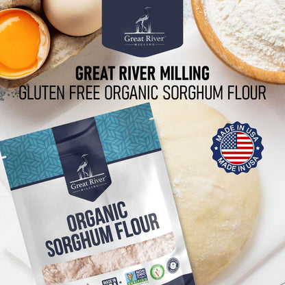 The Great River Milling Organic Sorghum Flour package is prominently displayed, featuring a blue and white design with the logo. Nearby, dough and baking ingredients are visible