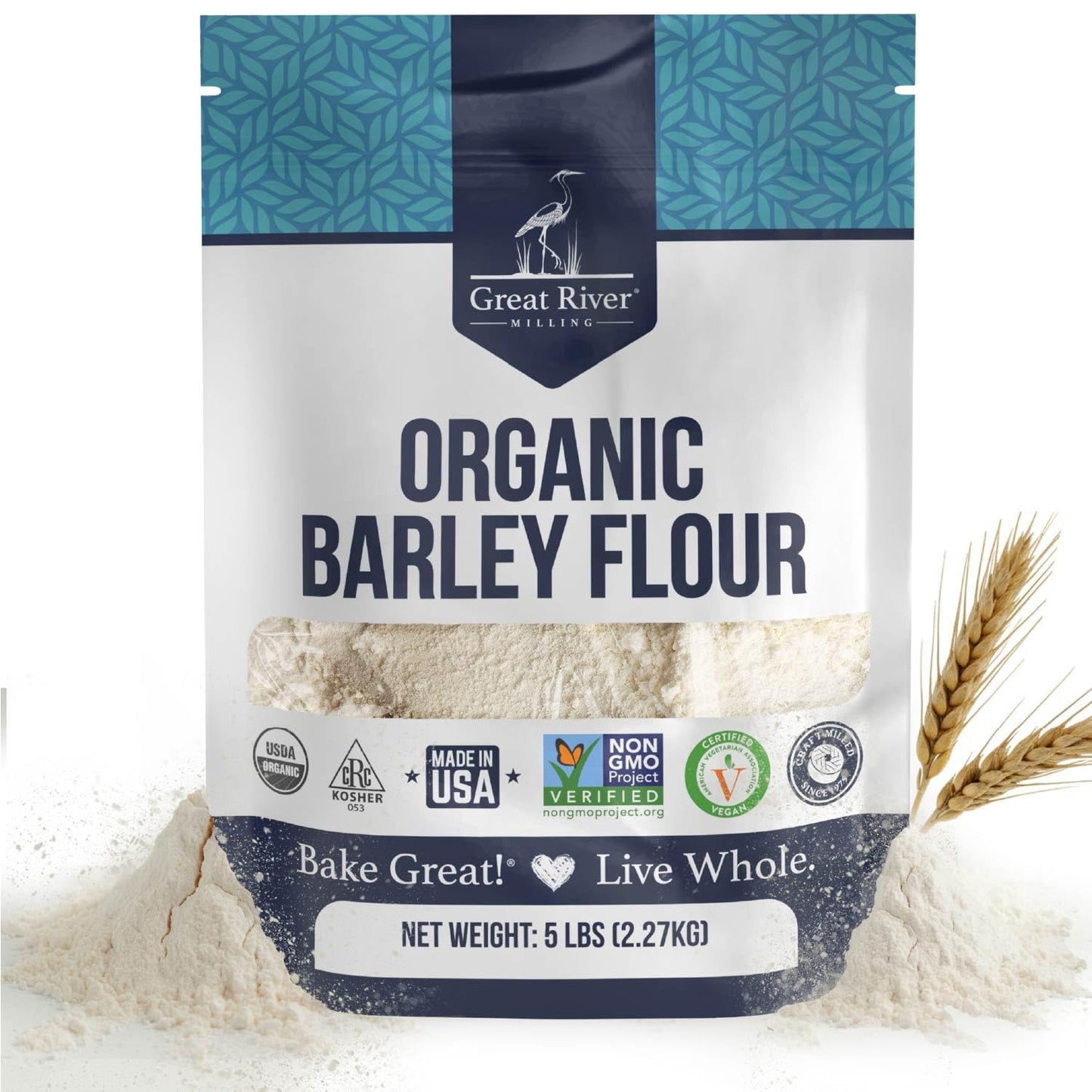 A 25 lb bag of Great River Milling Organic Barley Flour with a blue and white design, featuring logos indicating it's non-GMO, organic, and glyphosate-free. Two wheat stalks lie beside the bag