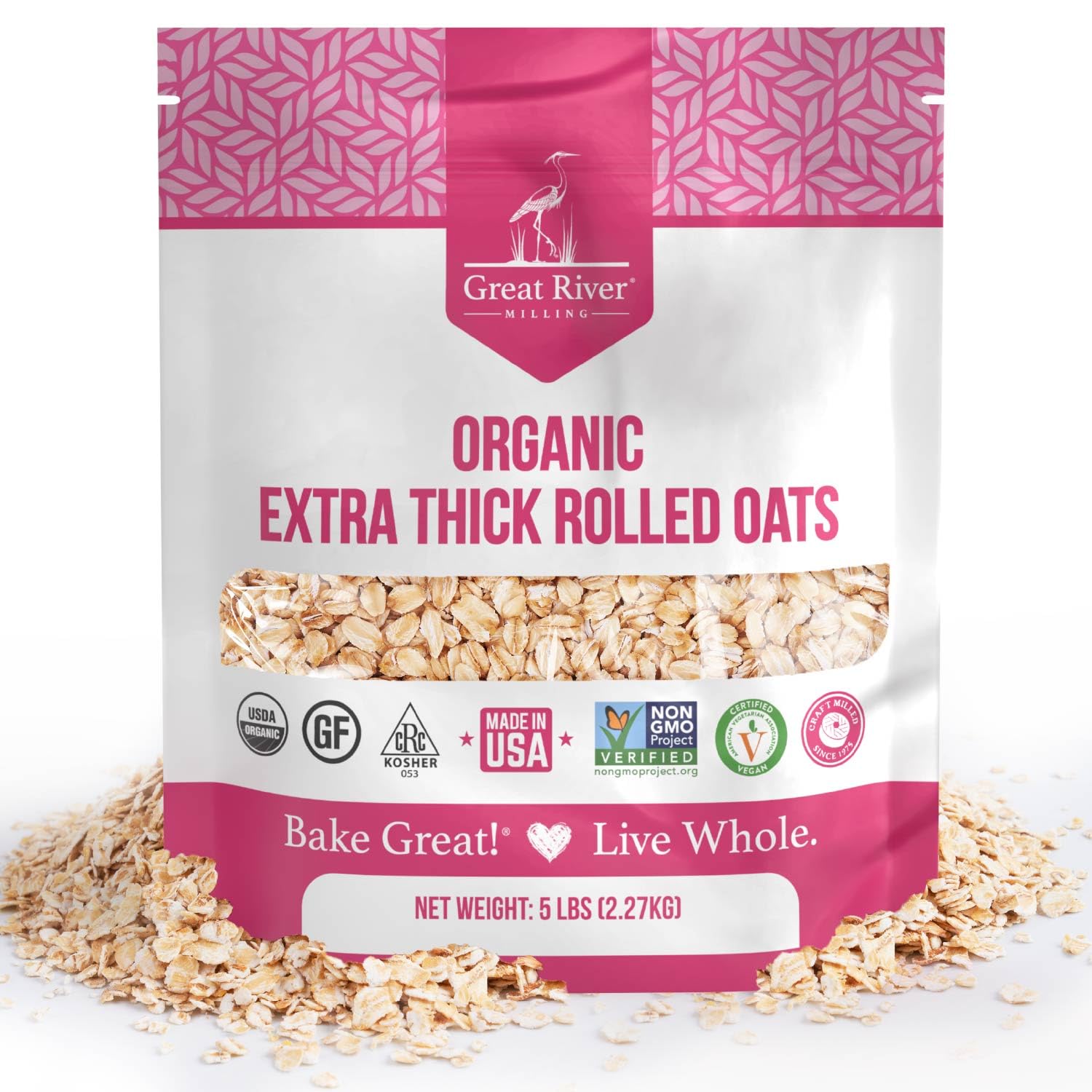 A 25 lb bag of Great River Milling Organic Extra Thick Rolled Oats, featuring a pink and white design with various certification logos and visible oats through a clear window