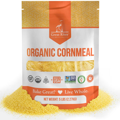 Organic Medium Grind Cornmeal bag from Great River Milling with yellow cornmeal scattered around it