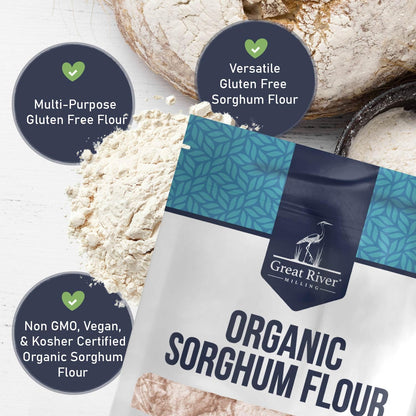 The Great River Milling Organic Sorghum Flour package is displayed against a backdrop of scattered flour and bread. The packaging features a blue geometric pattern