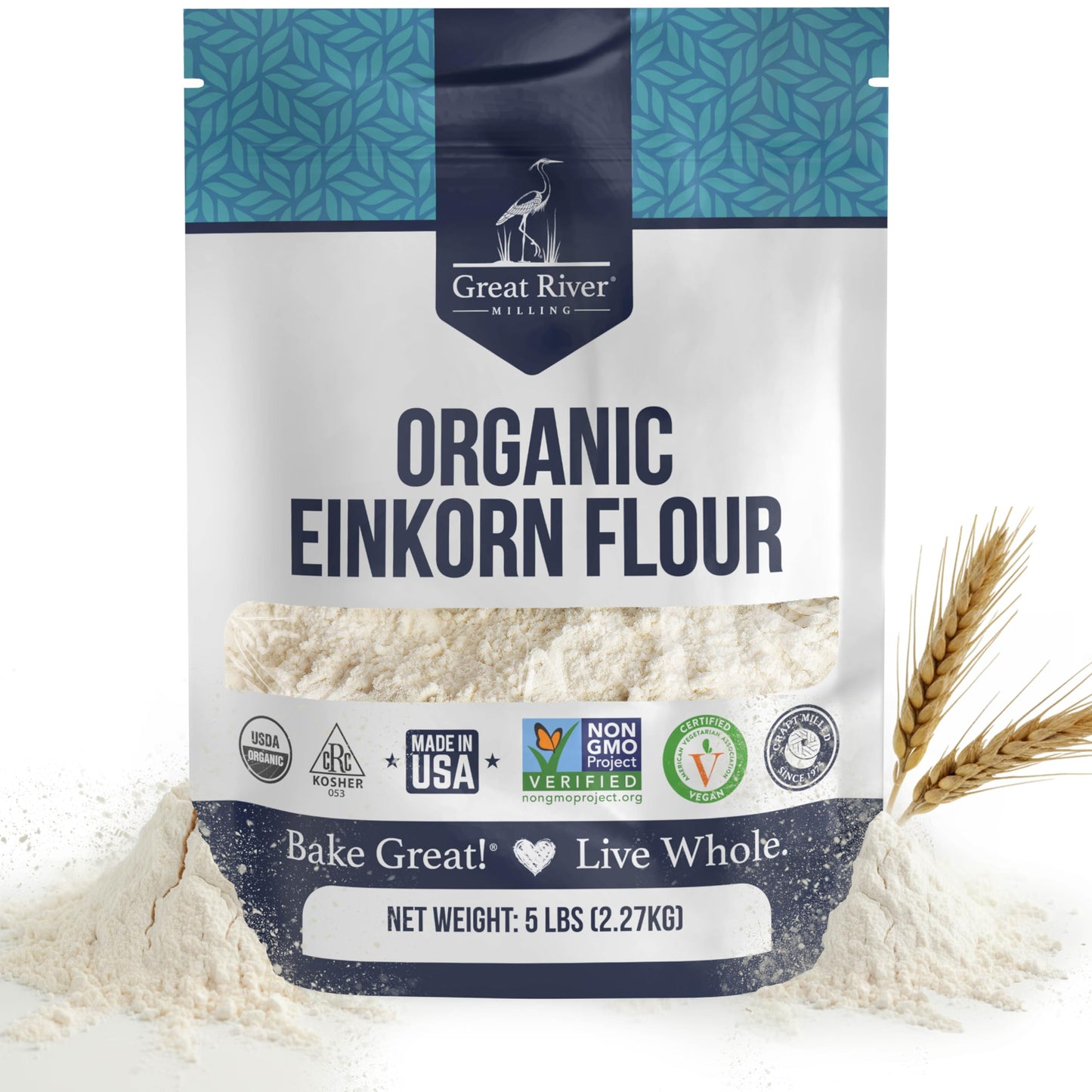 A 5 lb bag of Organic Einkorn Flour is shown with wheat stalks beside it. The blue and white packaging is decorated with quality seals, emphasizing its pure, organic origins and highlighting that it’s an ancient wheat flour.