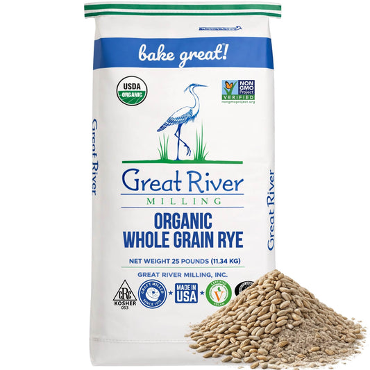 Organic Rye Berries in a Great River Milling bag with whole rye grains beside it