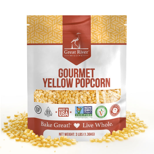 Great River Milling Gourmet Yellow Popcorn Kernels in a 3 lb bag, featuring a vibrant yellow kernel pattern. The packaging highlights various certifications and a "Made in USA" label