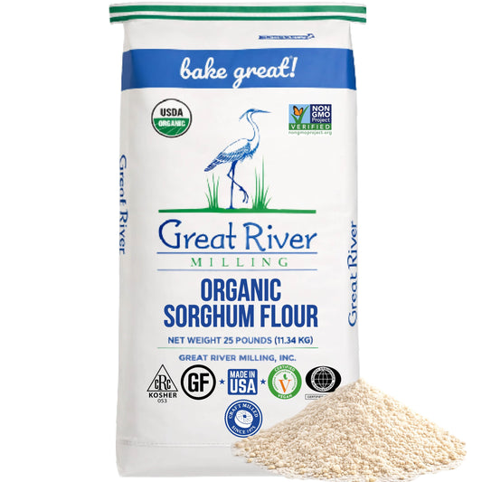 A 25 lb bag of Great River Milling Organic Sorghum Flour with a white and blue design, featuring a crane illustration and organic certification logos
