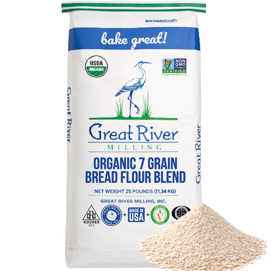 Organic 7-Grain Bread Flour bag from Great River Milling with a mound of flour beside it
